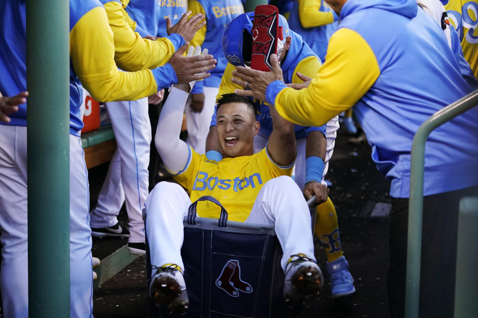 Boston Red Sox's Rob Refsnyder celebrates after his two run home run during the third inning of a baseball game against the Detroit Tigers, Wednesday, June 22, 2022, at Fenway Park in Boston. (AP Photo/Charles Krupa)