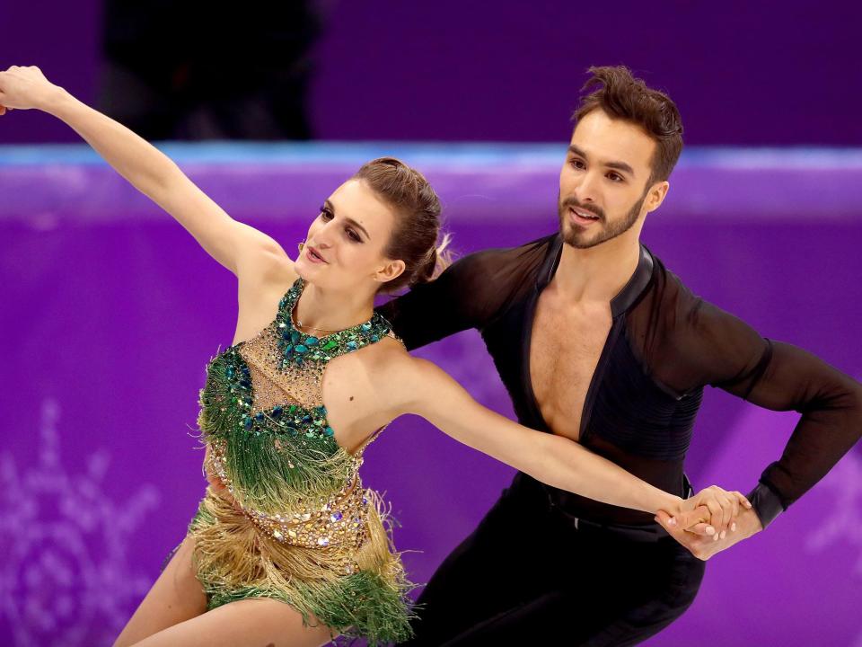 Gabriella Papadakis bravely completed her routine with Guillaume Cizeron after suffering a wardrobe malfunction: Getty