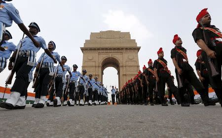 Indian soldiers march at the India Gate war memorial during a ceremony to commemorate 50th anniversary of a war between India and Pakistan, in New Delhi, India, August 28, 2015. REUTERS/Adnan Abidi