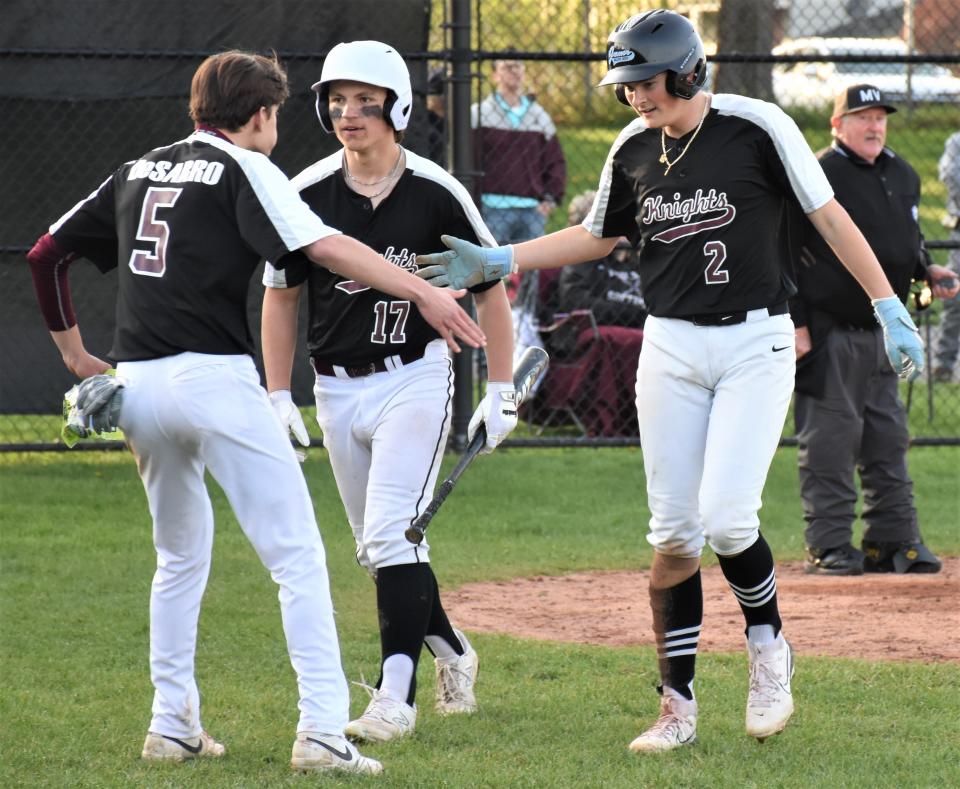 Angelo DeSarro greets Frankfort-Schuyler teammate Brayden Wisheart (2) after Wisheart scored the Maroon Knights' second run on a play in the sixth inning of Monday's 7-3 win over Oriskany.
