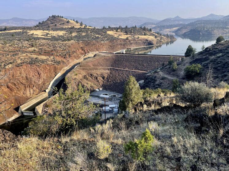 The Iron Gate Dam is seen in Hornbrook, Calif., Sept. 17, 2023. The dam is one of a series of four dams along the Klamath River which are part of the largest dam removal project in United States history. Now underway along the Oregon border, the process won't conclude until the end of next year with the help of heavy machinery and explosives. (AP Photo/Haven Daley)