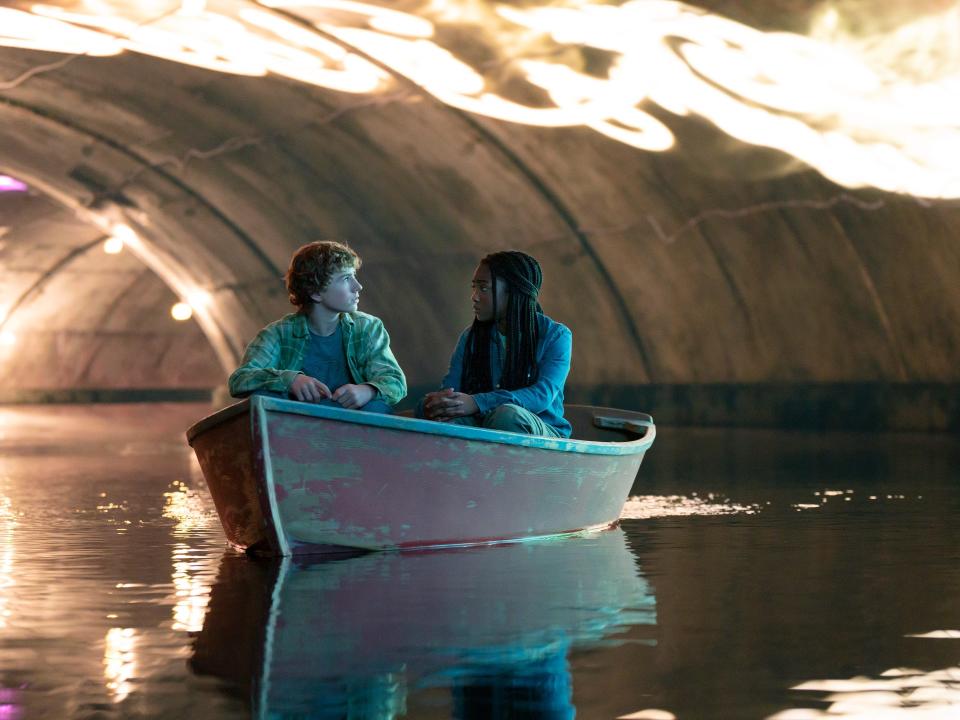 percy and annabth in a small boat within a tunnel in percy jackson and the olympians