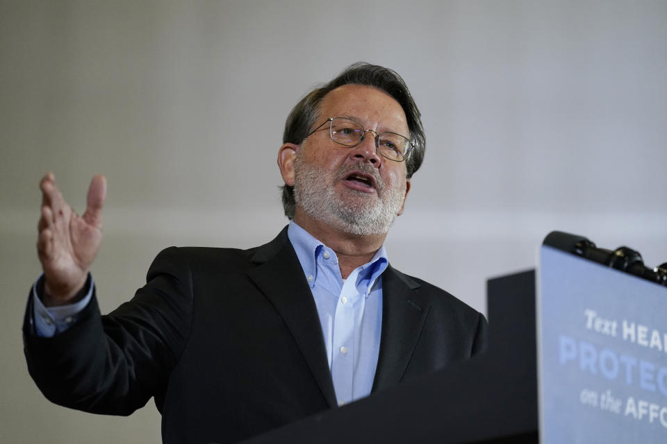 Sen. Gary Peters, D-Mich., speaks during an event with Democratic presidential candidate former Vice President Joe Biden at Beech Woods Recreation Center, in Southfield, Mich., Friday, Oct. 16, 2020. (AP Photo/Carolyn Kaster)