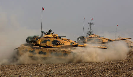 Turkish tanks maneuver during a military exercise near the Turkish-Iraqi border in Silopi, Turkey, September 22, 2017. REUTERS/Umit Bektas