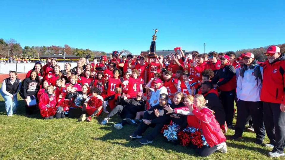 The Coventry Knotty Oakers pose for their victory photo after beating West Warwick on Thanksgiving Day.