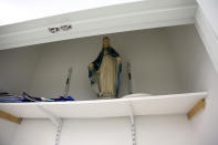 A statue of the Virgin Mary sits in an empty closet of a classroom at Queen of the Rosary Catholic Academy in Brooklyn borough of New York, Thursday, Aug. 6, 2020. Catholic leaders announced in July that a total of 26 New York City area schools will close permanently in August. (AP Photo/Jessie Wardarski)