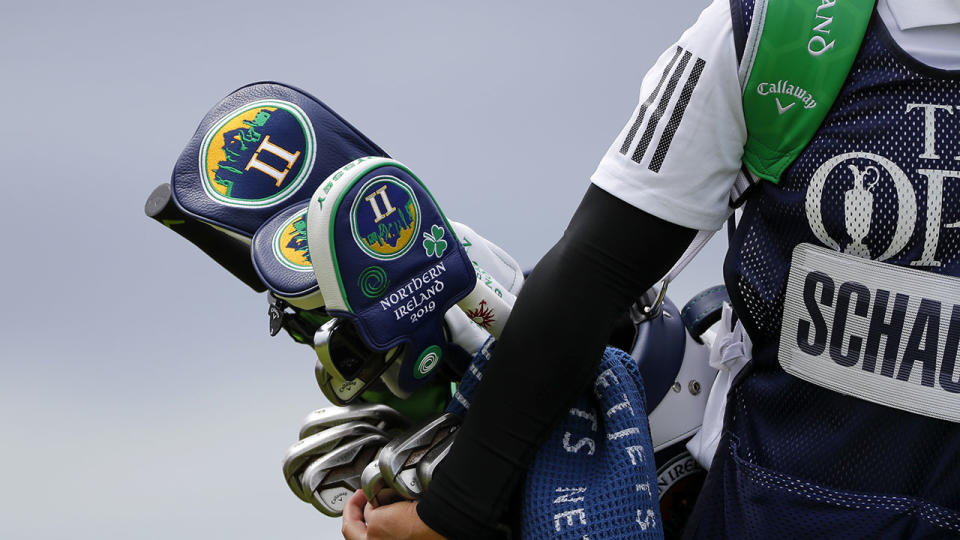 Xander Schauffele's caddie carries his bag at the British Open. (Photo by Kevin C. Cox/Getty Images)