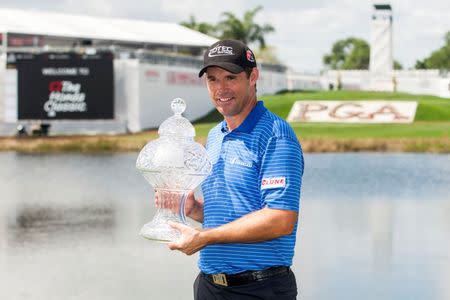 Mar 2, 2015; Palm Beach Gardens, FL, USA; Padraig Harrington celebrates winning the Honda Classic at PGA National GC Champion Course. Peter Casey-USA TODAY Sports