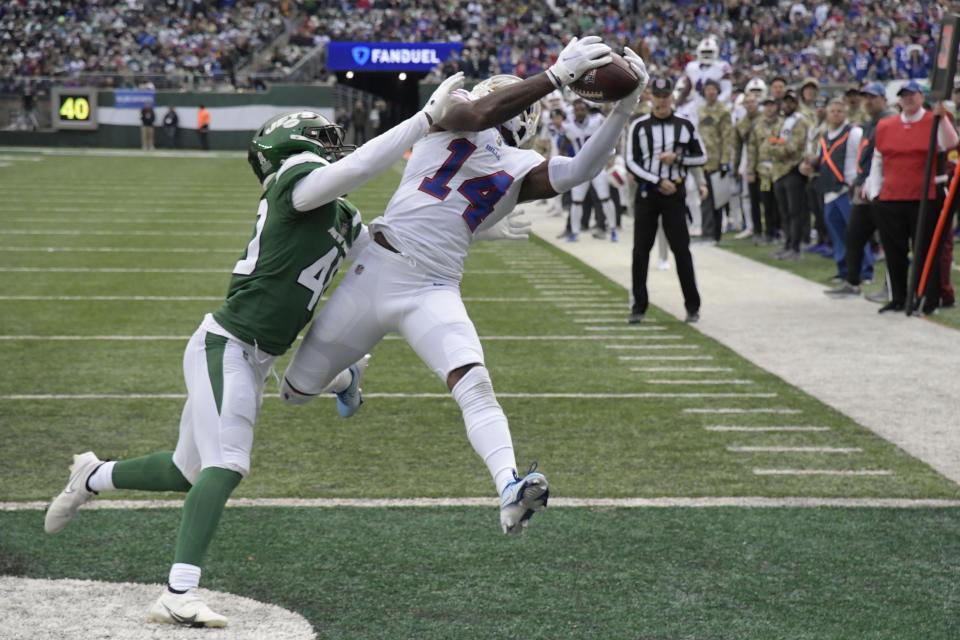 Buffalo Bills' Stefon Diggs, right, catches a touchdown in front of New York Jets' Javelin Guidry during the first half of an NFL football game, Sunday, Nov. 14, 2021, in East Rutherford, N.J. (AP Photo/Bill Kostroun)