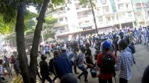 A-point-of-view from a volunteer medic running away with demonstrators from bullets, in Yangon