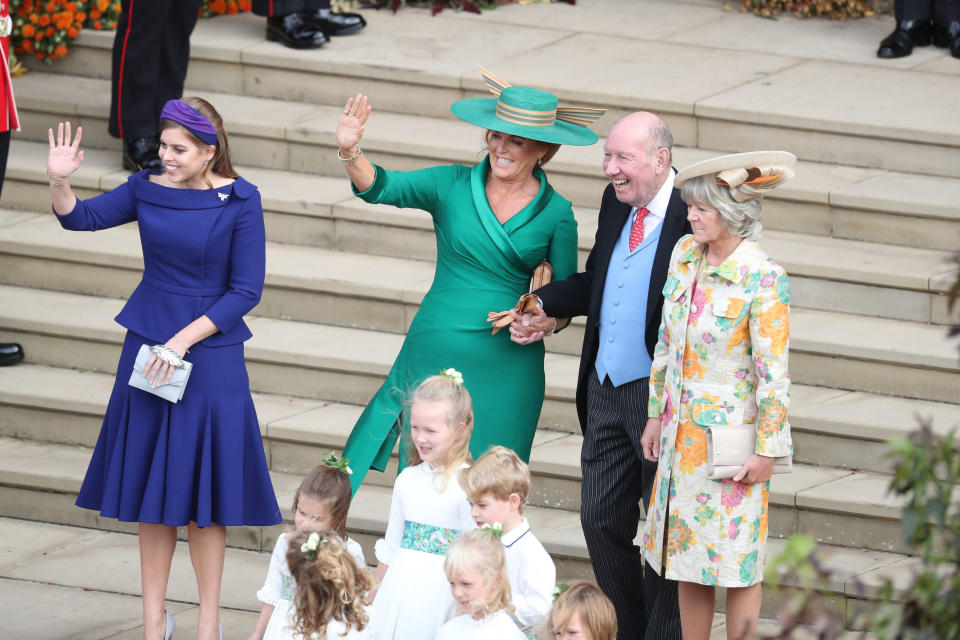 Britain's Princess Beatrice of York (L), Sarah, Duchess of York (C) and parents of the groom Nicola (R) and George Brooksbank wave off the married couple after attending the wedding of Britain's Princess Eugenie of York and Jack Brooksbank at St George's Chapel, Windsor Castle, in Windsor, on October 12, 2018. (Photo by Andrew Matthews / various sources / AFP)        (Photo credit should read ANDREW MATTHEWS/AFP via Getty Images)