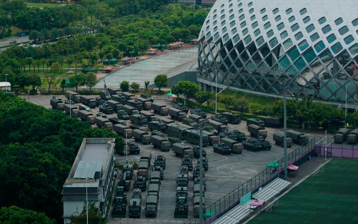 Armored vehicles have been spotted in Shenzhen, a Chinese city bordering Hong Kong - AP