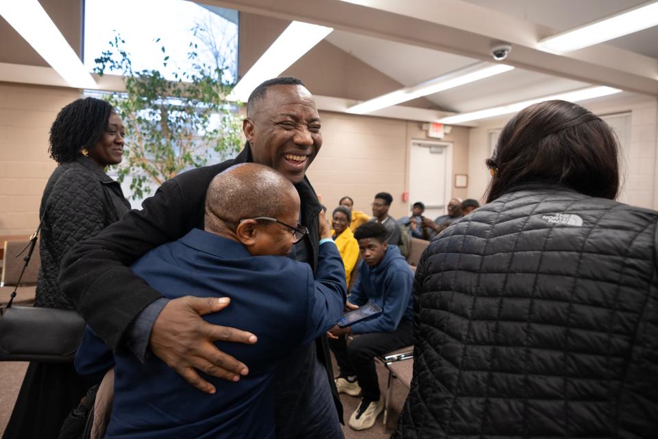 Mar 9, 2024; Haworth, NJ, USA; Omoyele Sowore hugs Ademola Bello during a homecoming celebration for him at Haworth Borough Hall. Omoyele Sowore, a Nigerian citizen, political activist, and journalist, who lives with his wife, son and daughter in Haworth, was detained by Nigerian authorities and imprisoned after he returned to his homeland.