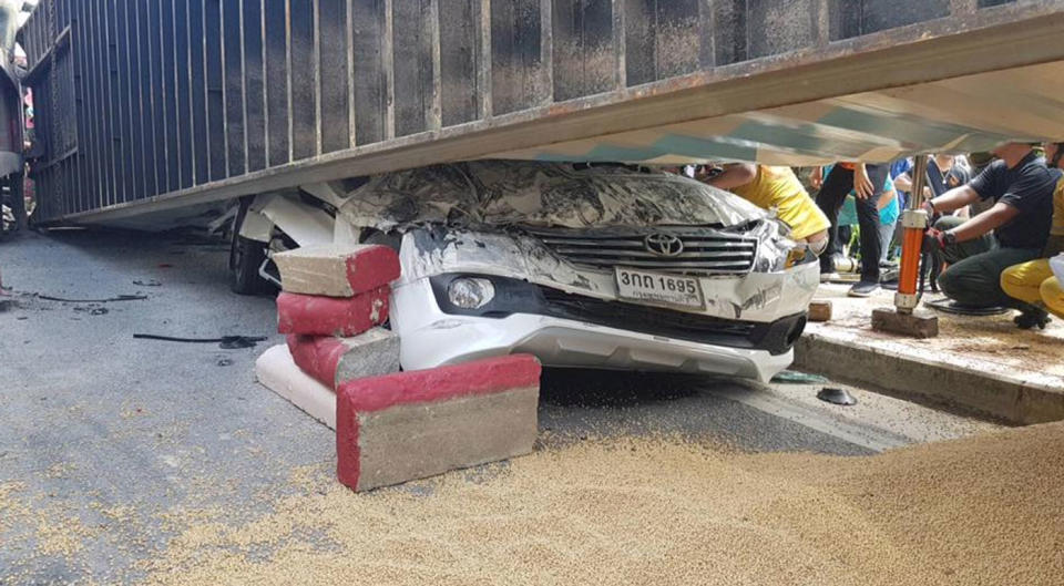 A driver has survived a horrific crash in Thailand after his car was crushed by a truck. Source: Australscope