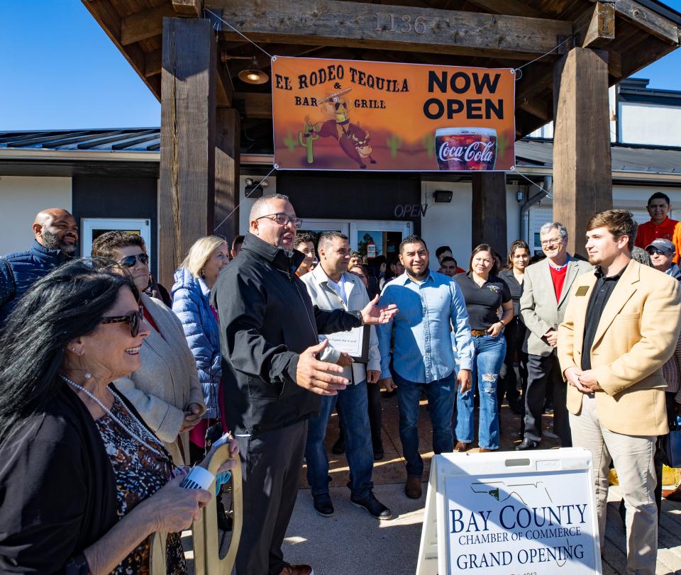 El Rodeo Tequila Bar and Grill held its grand opening Friday on Thomas Drive in Panama City Beach. Angel Baez, left, one of the owners of the restaurant, welcomes members of the Bay County Chamber of Commerce after the ribbon cutting.