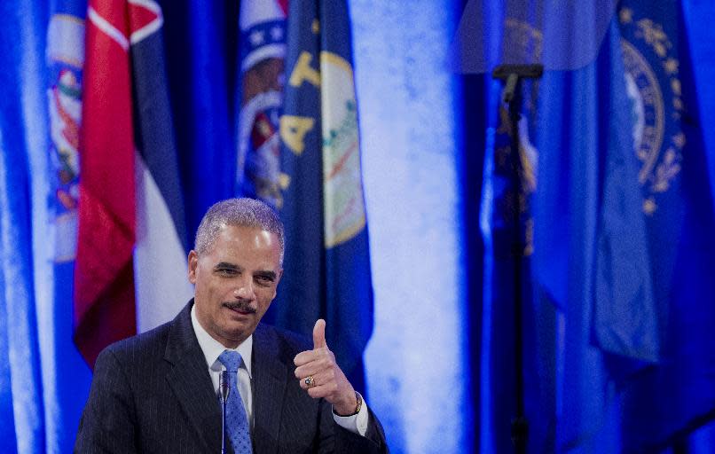 Attorney General Eric Holder gestures while speaking at the annual Attorneys General Winter Meeting in Washington, Tuesday, Feb. 25, 2014. Holder said state attorneys general are not obligated to defend laws in their states banning same sex-marriage if they don't believe in them. (AP Photo/Manuel Balce Ceneta)