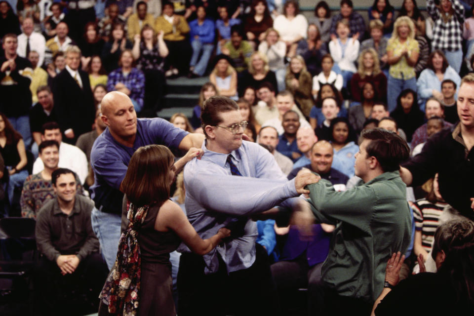 Security guard Steve Wilkos, left, tries to separate fighting guests on The Jerry Springer Show. The show's topic was 