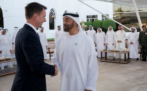 Abu Dhabi's Crown Prince Sheikh Mohammed bin Zayed al-Nahyan shake hands with British Foreign Minister Jeremy Hunt in Abu Dhabi - Credit: Reuters