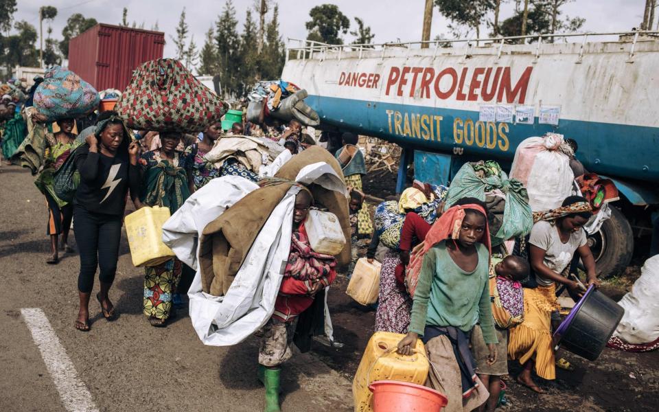 War-displaced people flee towards the city of Goma, eastern Republic of Congo - ALEXIS HUGUET/AFP via Getty Images