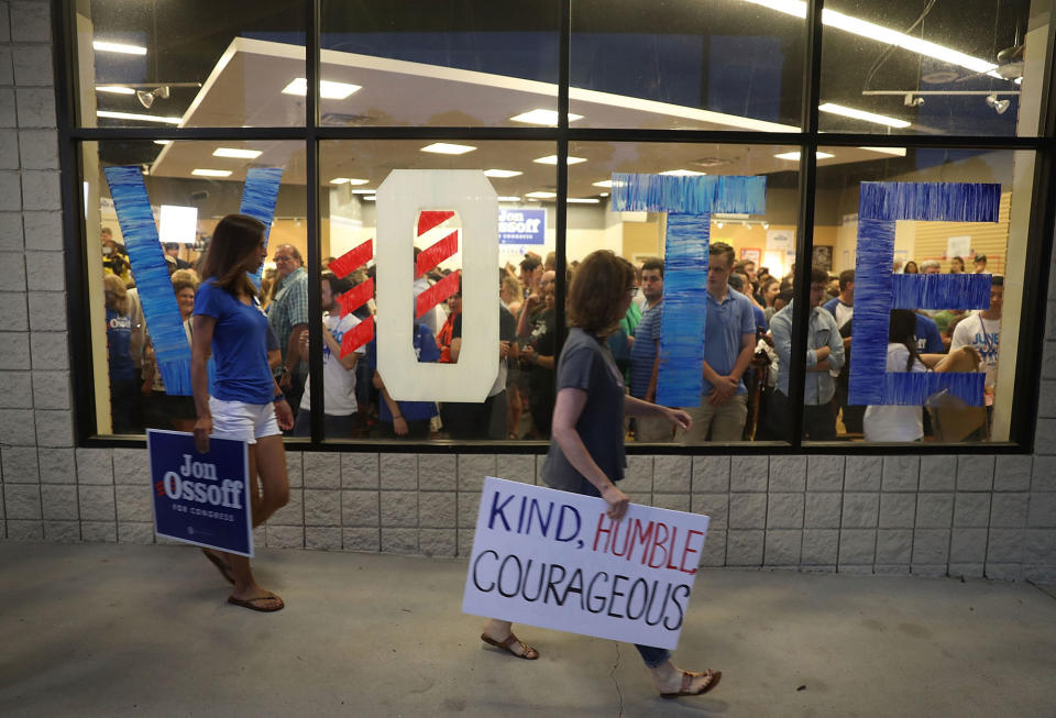 <p>People arrive to hear Democratic candidate Jon Ossoff speaks during a rally to thank volunteers and supporters on the last night before election day as he runs for Georgia’s 6th Congressional District on June 19, 2017 in Roswell, Ga. (Photo: Joe Raedle/Getty Images) </p>