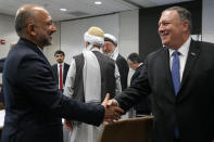 Secretary of State Mike Pompeo shakes hands with Hanif Atmar, Afghan Presidential Candidate and former National Security Adviser, during a meeting with Afghan politicians, Tuesday, June 25, 2019, during an unannounced visit to Kabul, Afghanistan. (AP Photo/Jacquelyn Martin, Pool)