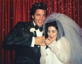 <p>Priscilla and Elvis Presley react to celebratory rice being thrown after their Las Vegas wedding in 1967. The couple held a very small ceremony at the Aladdin hotel in Las Vegas, only a few hours after <a href="https://www.vogue.com/article/wedding-elvis-presley-priscilla-presley" rel="nofollow noopener" target="_blank" data-ylk="slk:registering for their marriage license;elm:context_link;itc:0;sec:content-canvas" class="link ">registering for their marriage license</a> to avoid fanfare. </p>