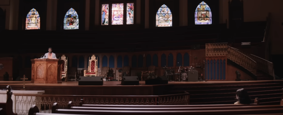 empty church with a pastor behind the podium