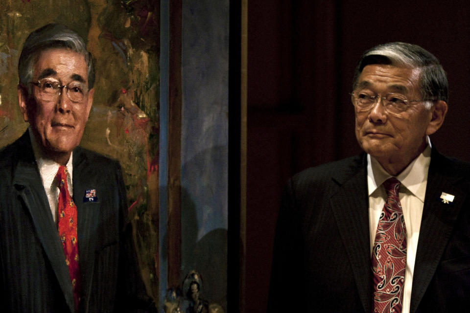 FILE - Norm Mineta, former transportation and commerce secretary, attends his portrait unveiling ceremony at the National Portrait Gallery, in Washington on July 26, 2010. The portrait was painted by artist Everett Raymond Kinstler. Mineta, who as federal transportation secretary ordered commercial flights grounded after the 9/11 terror attacks in 2001, died Tuesday, May 3, 2022. He was 90. (AP Photo/Drew Angerer, File)