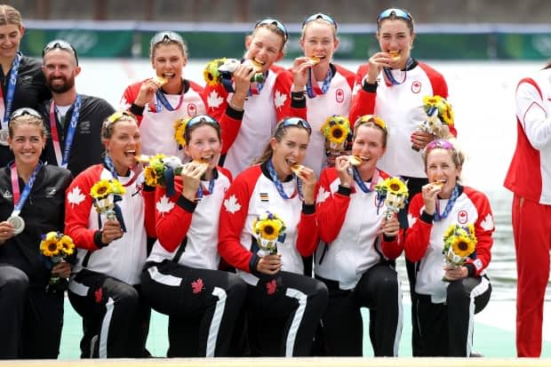 Gold medallists Lisa Roman, Kasia Gruchalla-Wesierski, Christine Roper, Andrea Proske, Susanne Grainger, Madison Mailey, Sydney Payne, Avalon Wasteneys and Kristen Kit of Canada pose during the medal ceremony for the women's rowing eight final at the Olympic Games Tokyo 2020. (Leon Neal/Getty Images - image credit)