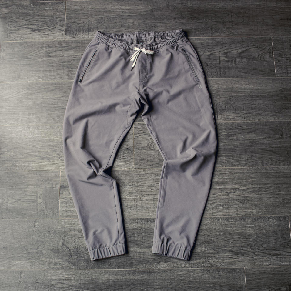 the vuori transit jogger in grey laying on my floor