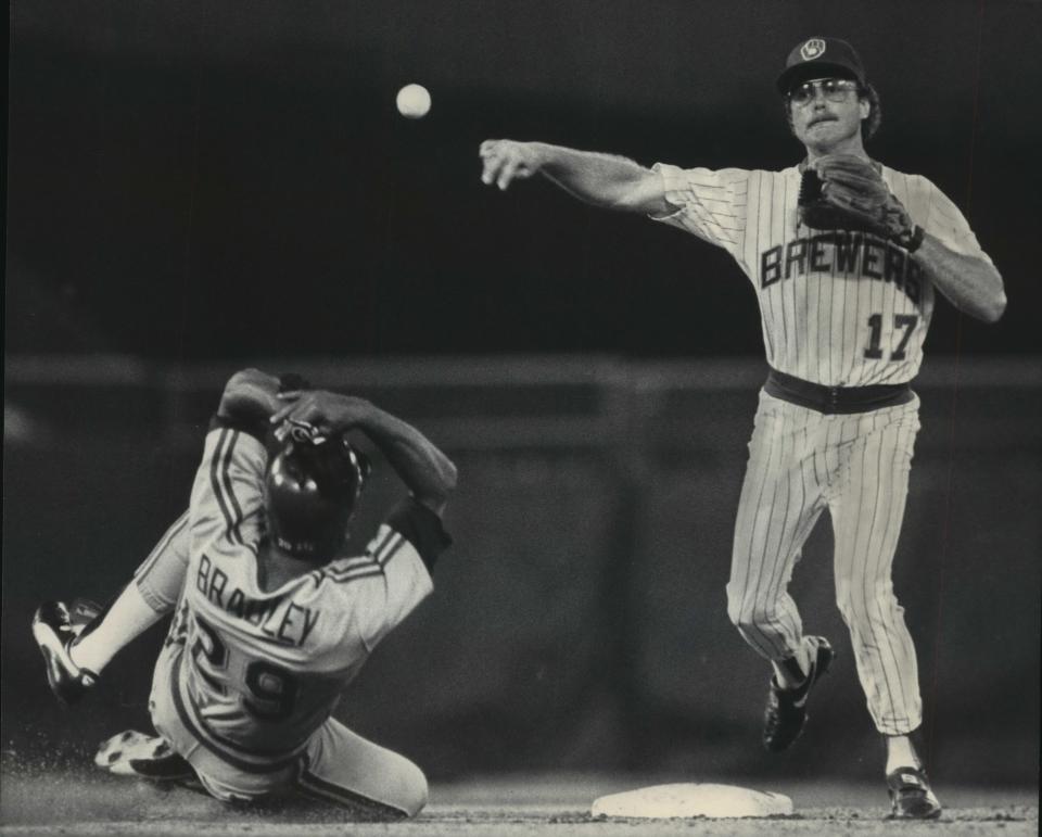 Jim Gantner throws to first to complete a double play in 1985.