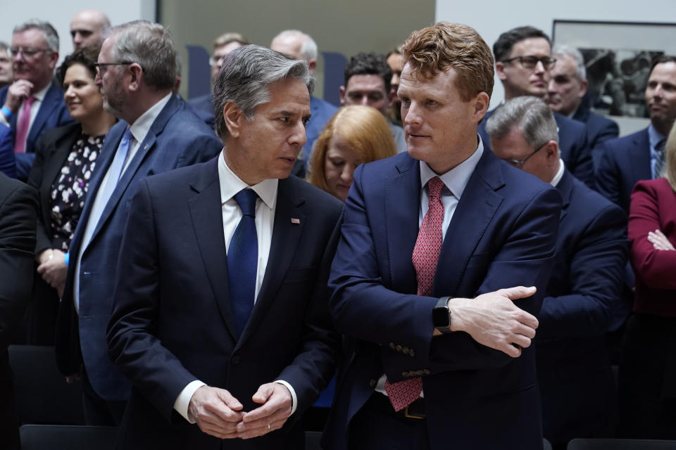 Secretary of State Antony Blinken talks with U.S. Special Envoy for Northern Ireland Joe Kennedy III, before President Joe Biden speaks at Ulster University in Belfast, Northern Ireland, Wednesday, April 12, 2023. (AP Photo/Patrick Semansky)