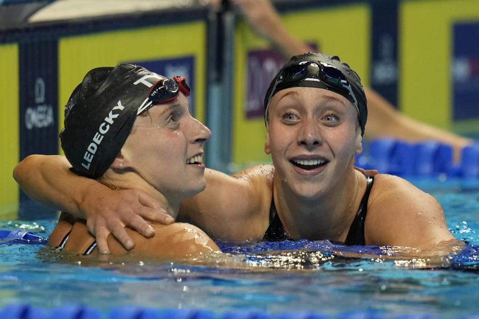 Katie Ledecky hugs Paige Madden, right, after winning the Women's 400 Freestyle during wave 2 of the U.S. Olympic Swim Trials on Monday, June 14, 2021, in Omaha, Neb. (AP Photo/Jeff Roberson)