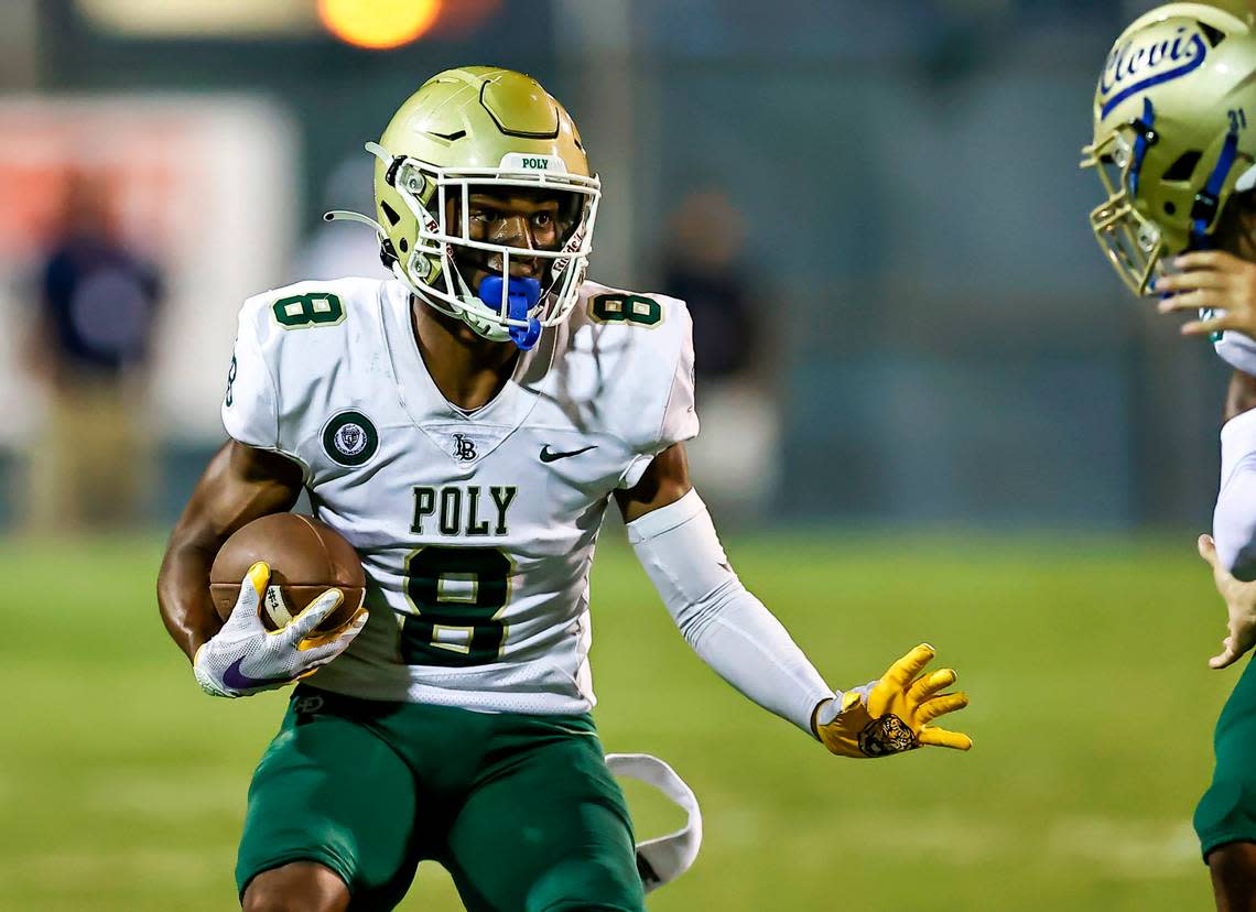 Long Beach Poly wide receiver and defensive back Daylen Austin (8) during a game against Clovis on Thursday, Aug. 18, 2022 at Lamonica Stadium in Clovis, Calif.