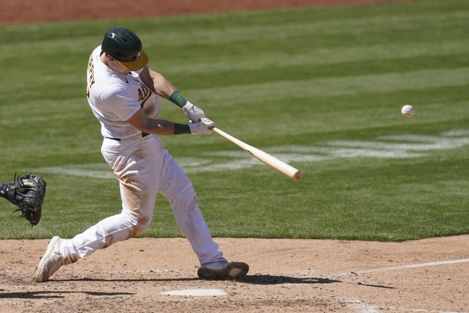 Oakland Athletics' Sean Murphy hits a solo home run against the Detroit Tigers during the eighth inning of a baseball game in Oakland, Calif., Sunday, April 18, 2021. (AP Photo/Jeff Chiu)