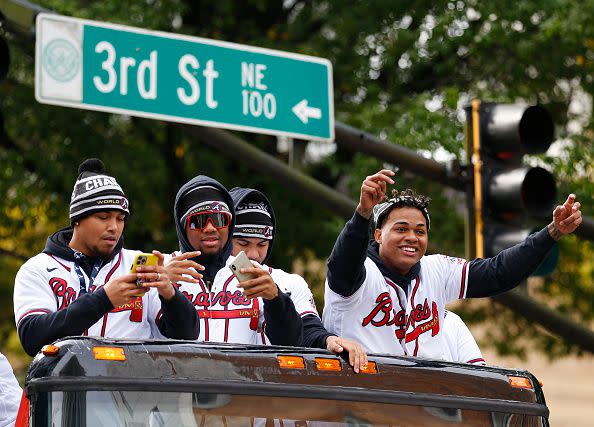 ATLANTA, GEORGIA - NOVEMBER 05:  Atlanta Braves players (from left to right) Orlando Arcia #9, Ronald Acuna, Jr. #13, Huascar Ynoa #19 and Cristian Pache #25 celebrate during the World Series Parade on November 05, 2021 in Atlanta, Georgia. (Photo by Michael Zarrilli/Getty Images)