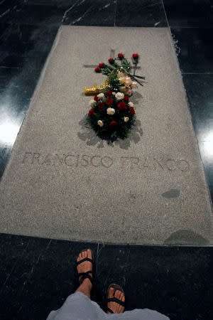 FILE PHOTO: The tomb of dictator Francisco Franco is seen inside El Valle de los Caidos (The Valley of the Fallen), the giant mausoleum holding the remains of Franco, outside Madrid July 12, 2011. REUTERS/Andrea Comas/File Photo