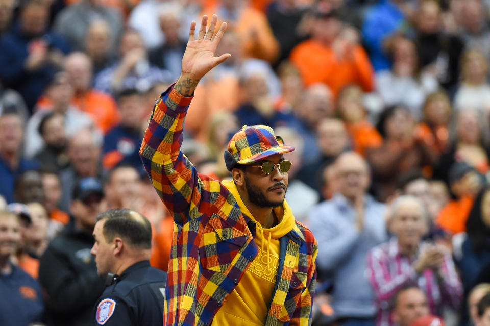 SYRACUSE, NY - NOVEMBER 06:  Syracuse Orange basketball alum Carmelo Anthony waves to the crowd during the first half of the game between the Virginia Cavaliers and the Syracuse Orange at the Carrier Dome on November 6, 2019 in Syracuse, New York. Virginia defeated Syracuse 48-34. (Photo by Rich Barnes/Getty Images)