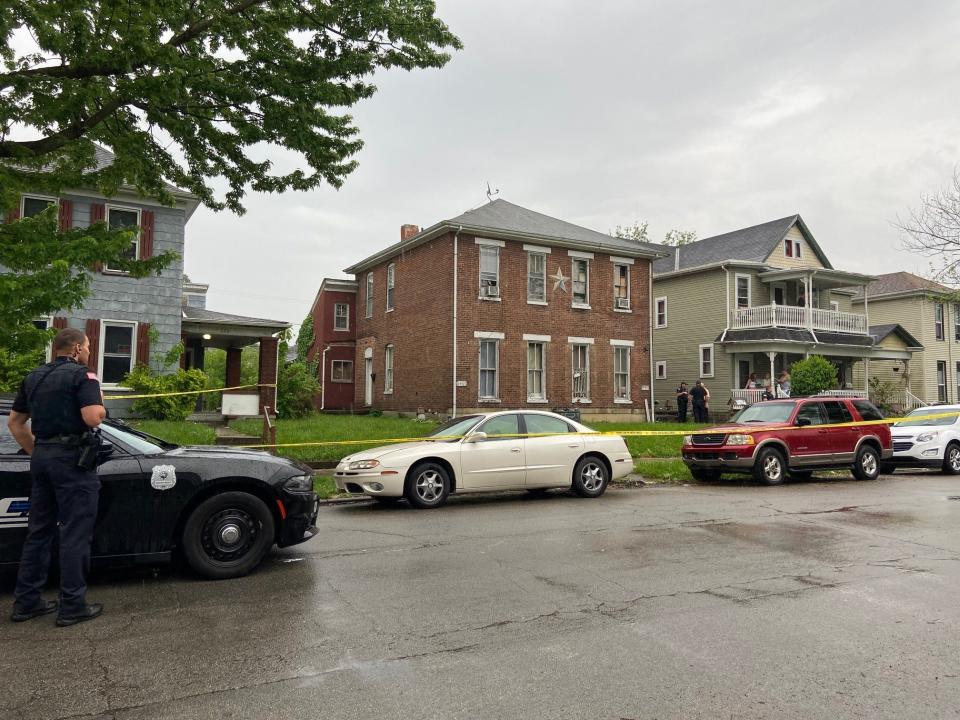 Crime scene tape surrounds the building on S. 12th St. after two people were shot Wednesday, May 18, 2022.