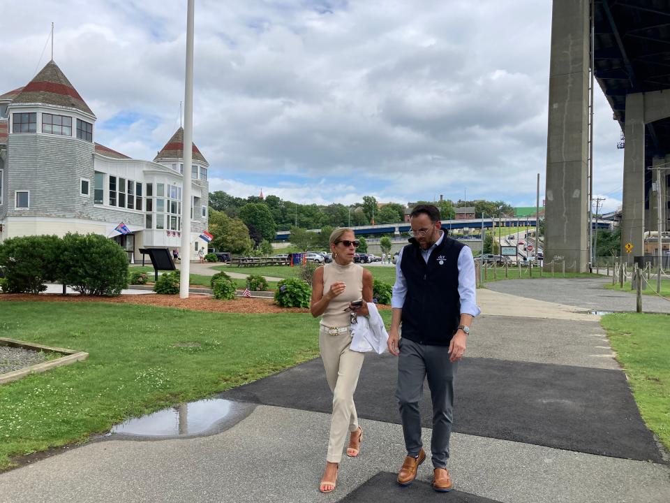 State Rep. Carole Fiola of Fall River walks with Department of Conservation and Recreation Commissioner Brian Arrigo at Battleship Cove in Fall River on Aug. 8, 2023.