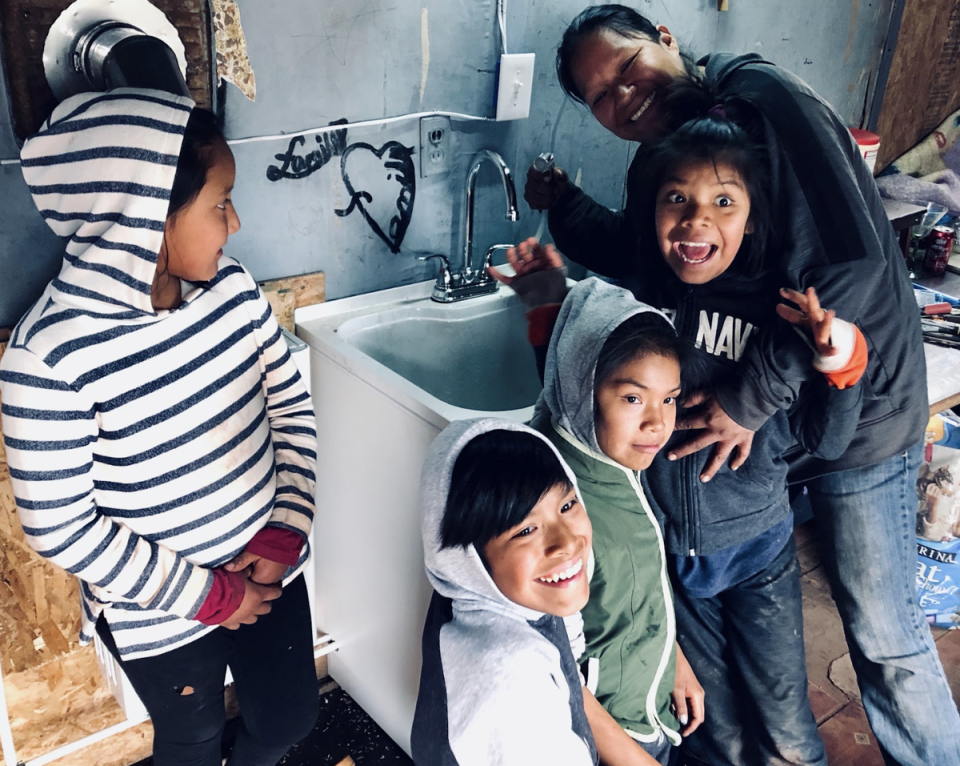 A family on the Navajo Nation celebrate their new water supply (DigDeep)