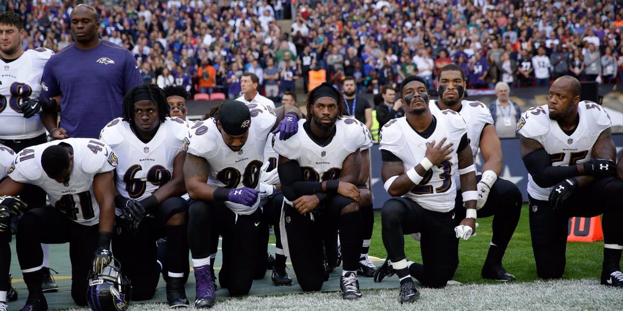 Baltimore Ravens kneel for anthem
