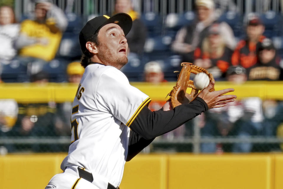 Pittsburgh Pirates second baseman Alika Williams pulls in a pop fly hit by Baltimore Orioles' Adley Rutschman during the sixth inning of a baseball game Saturday, April 6, 2024, in Pittsburgh. (AP Photo/Matt Freed)