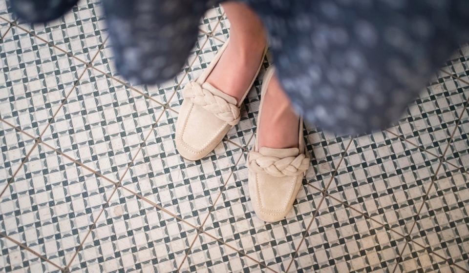 Woman wearing her brown flats