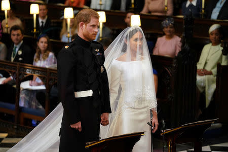 Prince Harry and Meghan Markle in St George's Chapel at Windsor Castle for their wedding in Windsor, Britain, May 19, 2018. Dominic Lipinski/Pool via REUTERS