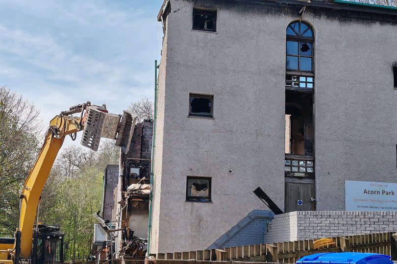 The bulldozers start work on the fire-ravaged care home -Credit:Andrea Lambrou/ReachPlc