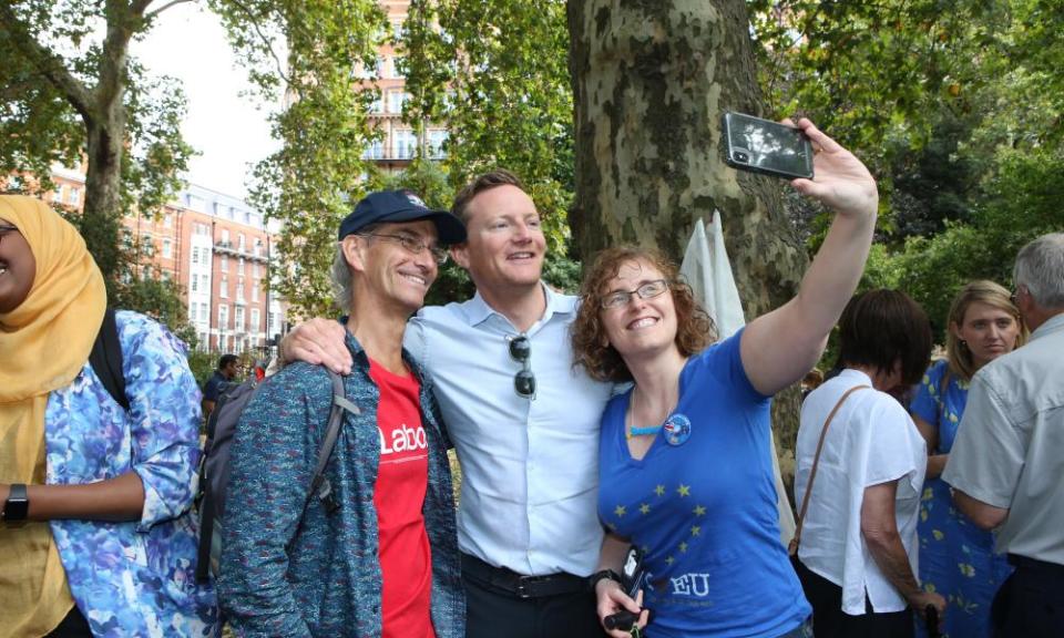 Seb Dance poses with anti-Brexit demonstrators