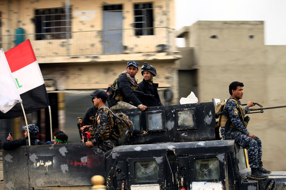 CTS sit in a military vehicle in Mosul