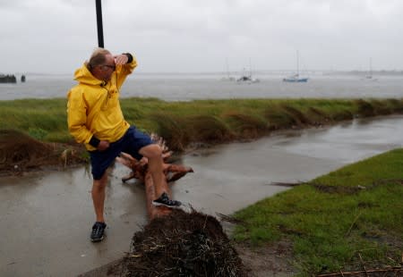 Resident Dabny Babbs checks on the status of his sail boat docked along the Ashley River during Hurricane Dorian in Charleston