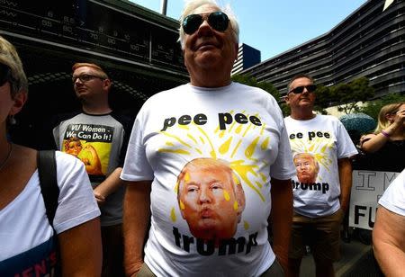Protesters wearing shirts displaying a picture of U.S. President Donald Trump participate in the first of hundreds of womens' marches organized around the world in a show of disapproval of the new President in Melbourne, Australia, January 21, 2017 AAP/Tracey Nearmy/via REUTERS